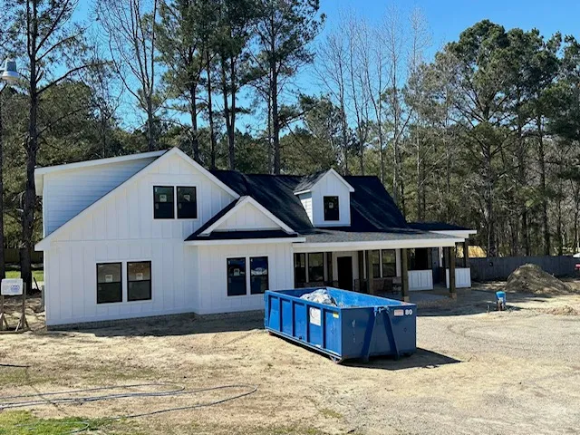 Modern farmhouse exterior with new addition