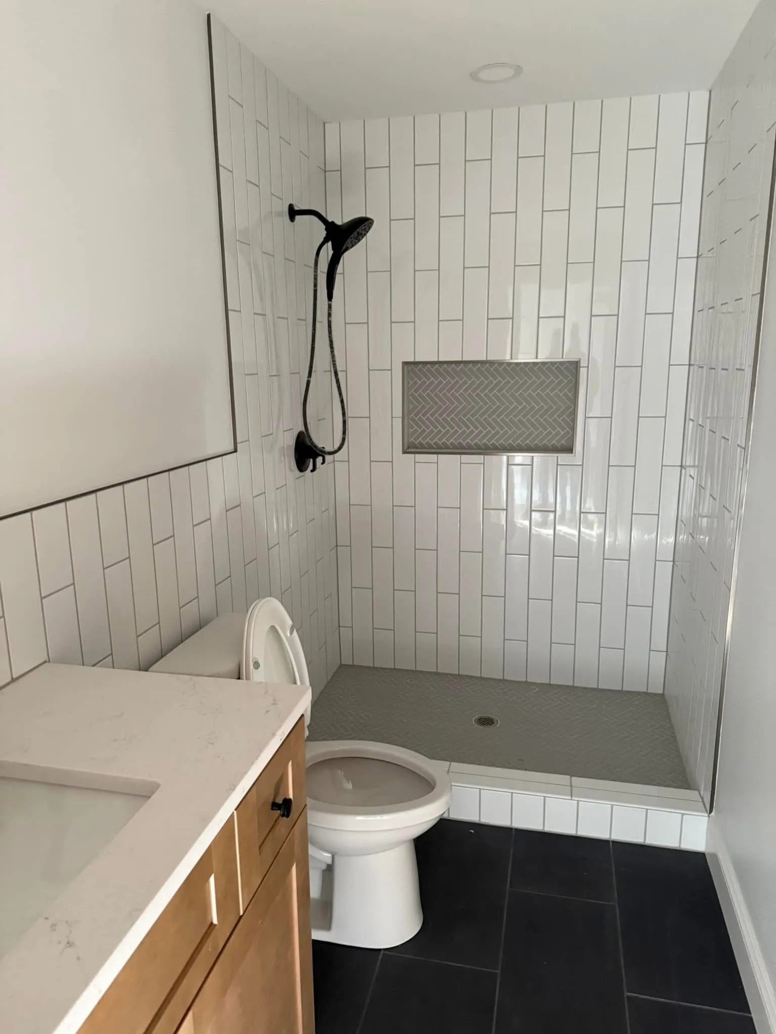 Walk-in tile shower with custom vanity