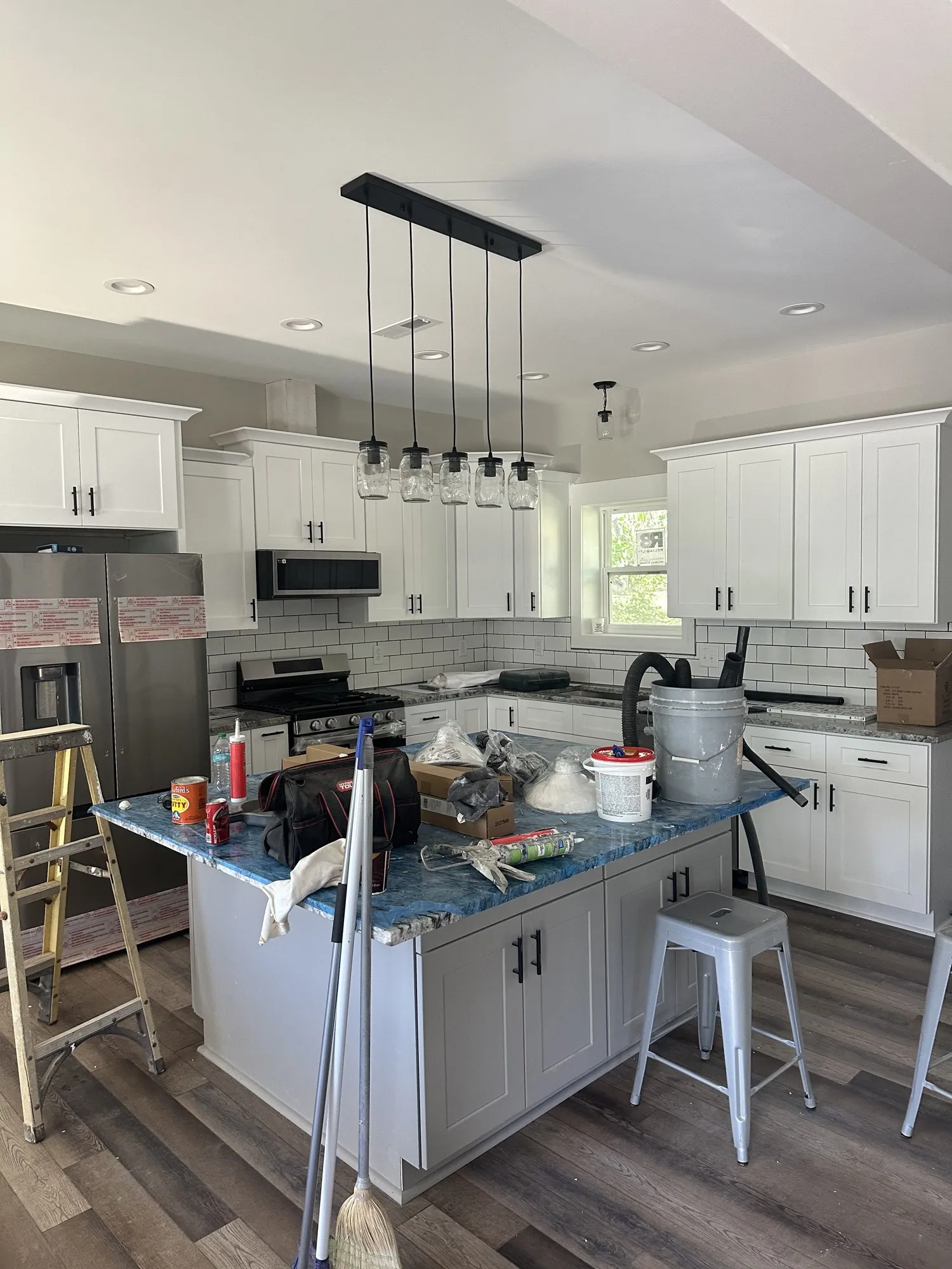 Kitchen cabinets and finishes going in