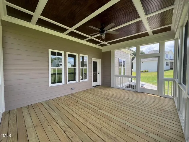 Covered back porch with stained coffered wood ceiling